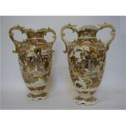 A PAIR OF SATSUMA WARE TWIN HANDLDED VASES, first half of the 20th Century, theatrical figures in...