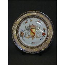 A PSEUDO ARMORIAL PLATE, early 20th Century, crown over a shield supported by two griffins, gilt...
