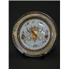Image 1 : A PSEUDO ARMORIAL PLATE, early 20th Century, crown over a shield supported by two griffins, gilt...