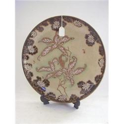 A SATSUMA 'TAIZAN' CIRCULAR WALL PLAQUE , Meiji period, branch design on a crackle glaze ground,...