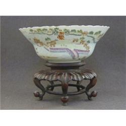 A FAMILLE VERTE DECORATED BOWL, extensive island scene and calligraphic verse, square seal mark,...