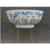 Image 1 : A QUIANLONG PUNCH BOWL, famille rose figures in a blue rococo cartouche border, diameter 26cm, (r...