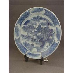 AN ORIENTAL EXPORT CHARGER, early 20th Century, underglaze blue lake scene, cell diaper border, d...