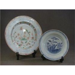 A CHILDS SAUCER DISH, Quinlong, underglaze blue decorated, and a polychrome plate, (restorations)...