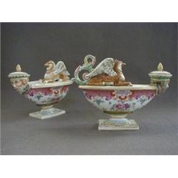 A PAIR OF INK WELLS, canoe shapes on rectangular bases with ormolu slips, decorated in famille ro...