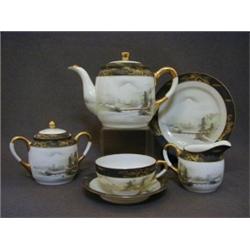AN EGGSHELL PORCELAIN TEA SET, 20th Century, teapot, cream, sugar, six cups/saucers and six tea p...