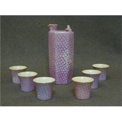 A SAKI SET, 20th Century, pink lustre with white spots, six cups and pot (7)  20-30...