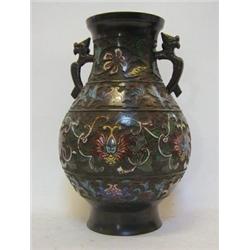 A BRONZE TWIN HANDLED BALUSTER VASE, raised cloisonne cells of trailing foliage on a textured gro...