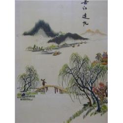 A SILK EMBROIDERED PANEL, sailing vessels on a river below a mountainous landscape, figure on bri...