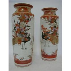 A PAIR OF KUTANI BALUSTER VASES, early 20th Century, exotic birds in a floral landscape, signed,...