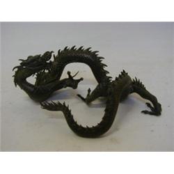A JAPANESE BRONZE, Meiji period, of coiled dragon (thought to be a scholars weight), rectangular...