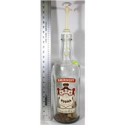 SMIRNOFF VODKA BOTTLE WITH SOME PENNIES INSIDE