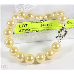 #6-SEA SHELL PEARL BRACELET 7.5" LIGHT YELLOW