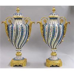 GOOD PAIR OF GILT BRONZE MOUNTED PORCELAIN URNS., Italian. By Tiche. Each spiral fluted body wi...