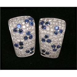 EXQUISITE PAIR OF DIAMOND AND SAPPHIRE EAR CLIPS, Pavé set with approximately ninety-four round...