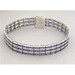 SAPPHIRE AND DIAMOND STRAIGHT LINE BRACELET, Composed of thirty-three rectangular links, set wi...