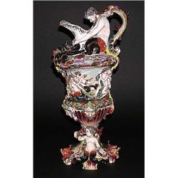 CAPO DI MONTE PORCELAIN EWER, Italian. Circa 1900. Molded in relief with mermaids, dolphins, pu...