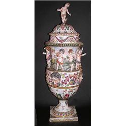 LARGE CAPO DI MONTE PORCELAIN URN AND COVER, Italian. Molded with male and female masks below a...