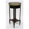Image 1 : EMPIRE STYLE MAHOGANY SIDE TABLE, Circa 1900. The circular marble top enclosed by a brass galle...