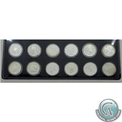 RCM Lot of 12x 1974-2001 Canada Proof Commemorative Silver Dollars in Blue Numis Tray. This lot incl