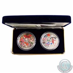 The People's Bank of China Issue: 1999 2-Coin .999 Fine Silver Colourized Coin Set. Comes in blue di