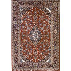 Pair of Keshan Rugs, Post 1950, Red ground with floral spray field centering a diamond medall...