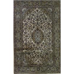 Keshan Rug, Post 1950, Beige ground with palmette and trellising vine field centering a lobed...