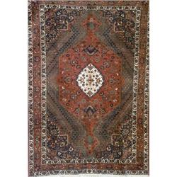 Baktiari Rug, Post 1950, Green ground with a rosette field centering a stepped medallion on a...