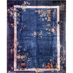 Chinese Rug, Second Quarter 20th Century, Blue ground with flowering urns, vases, birds and i...