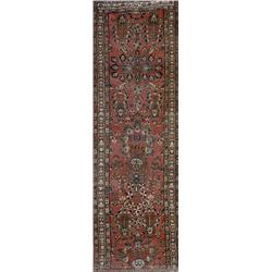 Sarouk Rug, Circa 1950, Red ground with flowering urn and floral spray field within a geometr...