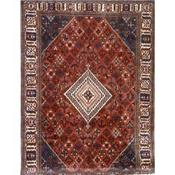 Joshaghan Rug, Post 1950, Red ground with floral spray field centering a stepped diamond meda...