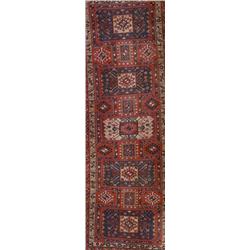 Hamadan Rug, Post 1950, Red ground with five joined octagonal medallions enclosing a geometri...