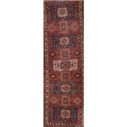 Hamadan Rug, Post 1950, Red ground with five joined octagonal medallions enclosing a geometri...