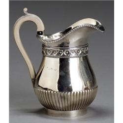 George III Silver Jug, Benjamin Smith, London, 1817, The parcel lobed body having a flowerhea...