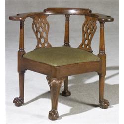 George III Walnut Corner Armchair, Circa 1770, Raised on open talon and ball feet. Repairs to...