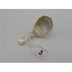 A GEORGIAN CADDY SPOON, shell bowl, makers mark rubbed, London 1829 £50-60...