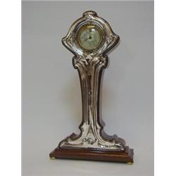 AN ART NOUVEAU MAHOGANY TIMEPIECE, stylized naturalistic form, 6cm Arabic dial, silver faced, mak...