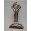 Image 1 : AN ART NOUVEAU MAHOGANY TIMEPIECE, stylized naturalistic form, 6cm Arabic dial, silver faced, mak...