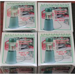 A GROUP OF 4 AUTOMATIC CHRISTMAS TREE WATERERS