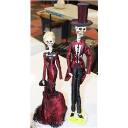 2 SKELETON FIGURINES