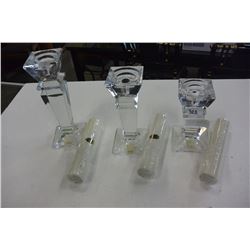 THREE POLISHED CRSYTAL CANDLESTICKS WITH CANDLES