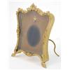 Image 1 : A French gilt brass miniature frame, in the form of an easel with stamped and applied foliate dec...