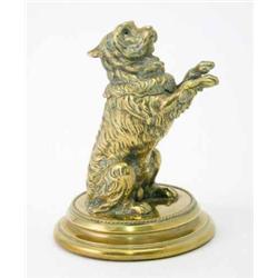 A novelty late 19th century brass dog inkwell, in the form of a begging terrier after Landseer, w...