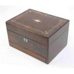 A Victorian rosewood toilet box, the cover with brass and mother-of-pearl inlay, the interior wit...