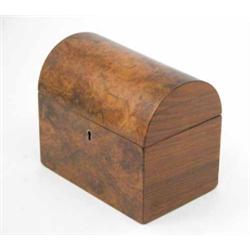 An early Victorian walnut tea caddy, with domed cover and twin partitions, 7 ins....