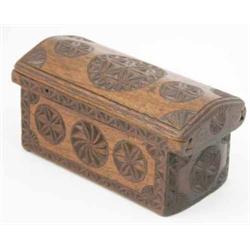A chip-carved rectangular oak love box, Welsh or Friesland, the domed sliding cover and sides car...