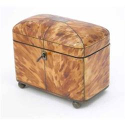 A George IV tortoiseshell tea caddy, the domed cover with silver wire inlay on ball feet, 6 ins....