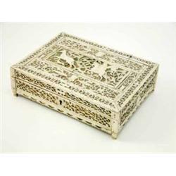 A Russian pierced bone and gilt wood casket decorated with a huntsman, masks and foliage, 8.5 ins...