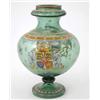 Image 1 : An armorial bottle green glass vase, enamelled with crest, set pattern borders and mock date, 166...