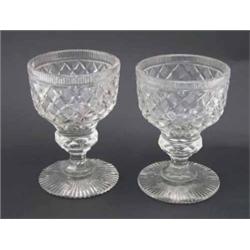 A pair of deeply-cut glass sweetmeat goblets, with faceted stems and cut bases, 6ins...